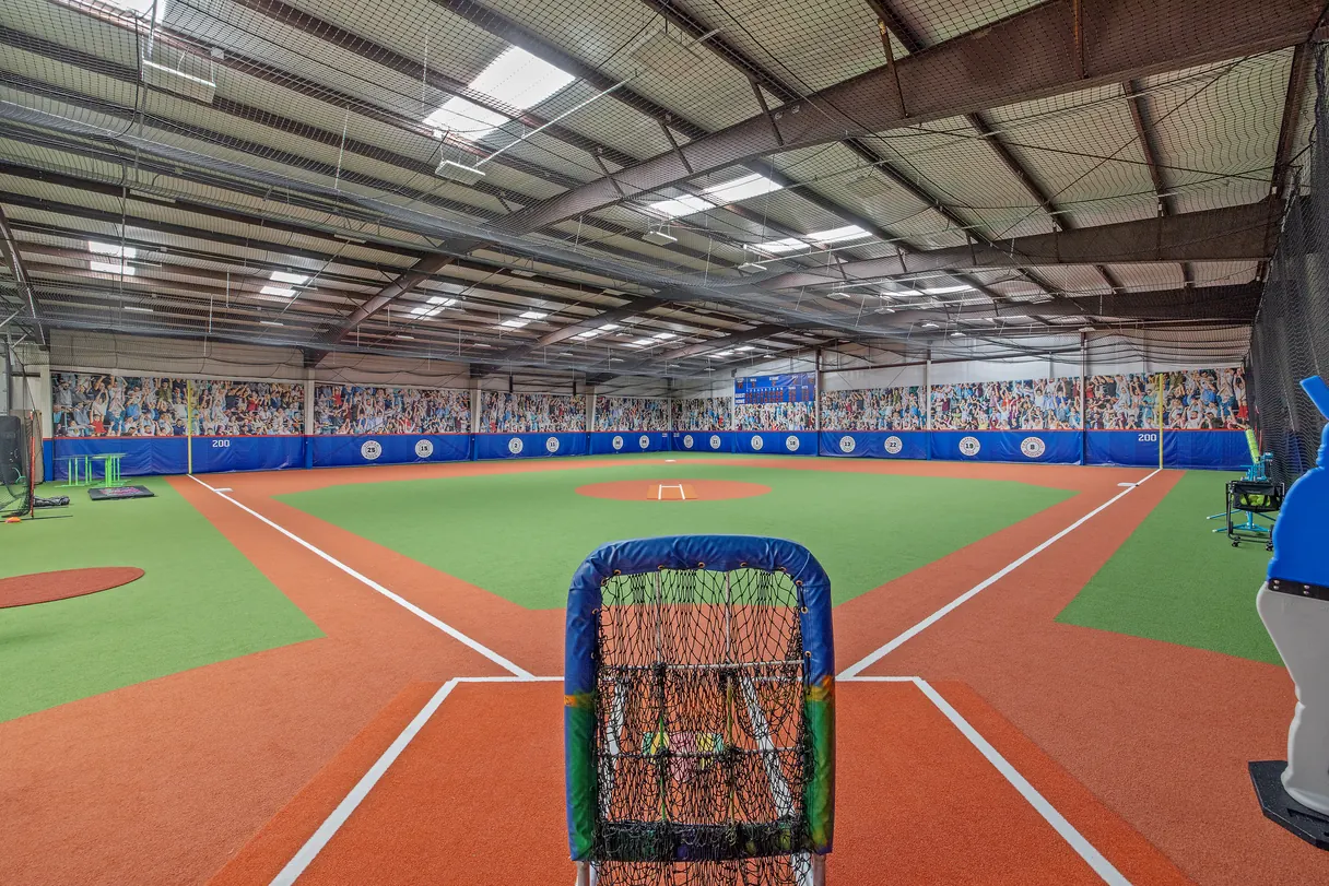 Indoor baseball training facility surfaced with SYNLawn artificial turf