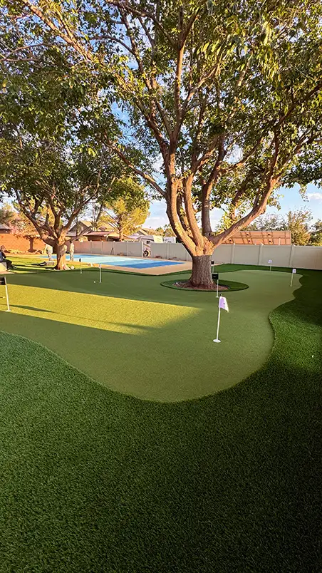 Rooftop terrace with two lounge chairs on artificial grass